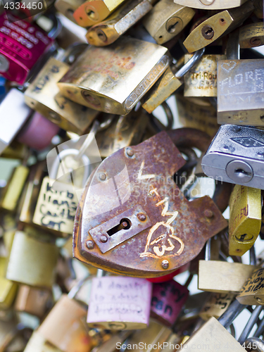 Image of Love locks in Paris bridge symbol of friendship and romance