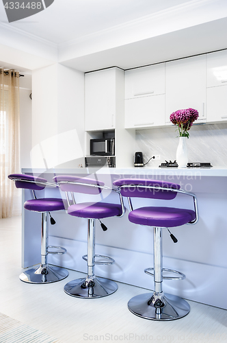 Image of white dining table in modern kitchen