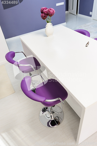 Image of white dining table in modern kitchen