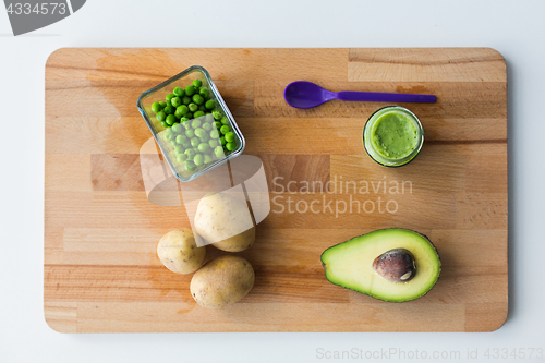 Image of vegetable puree or baby food on wooden board