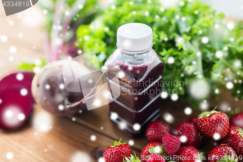 Image of bottle with beetroot juice, fruits and vegetables