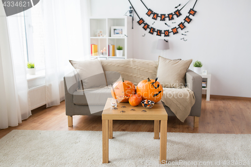 Image of jack-o-lantern and halloween decorations at home