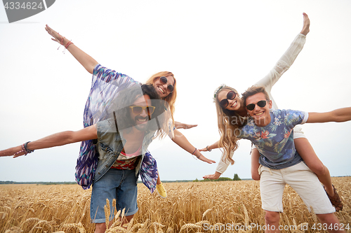 Image of happy hippie friends having fun on cereal field