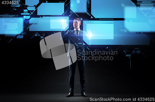 Image of businessman working with virtual screen