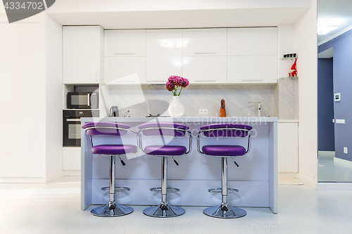 Image of white dining table in modern kitchen