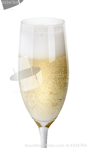 Image of Closeup of glass of champagne with foam