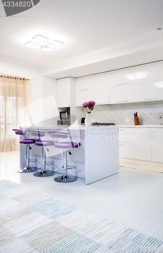 Image of white dining table in modern kitchen