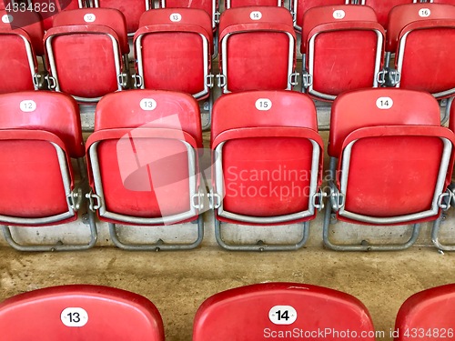 Image of Bright red plastic seats in a stadium
