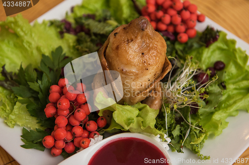 Image of quail roasted with sweet and sour cranberry sauce