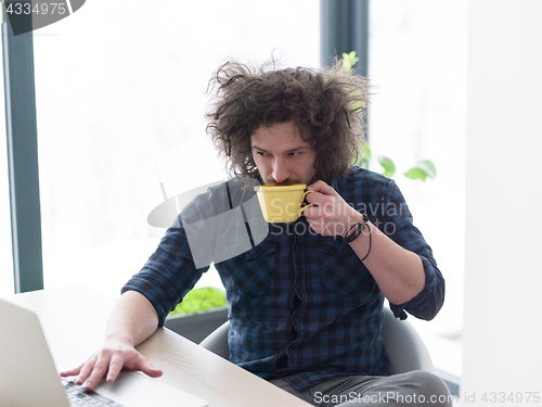 Image of man working from home