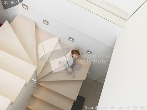 Image of little cute girl enjoying on the stairs