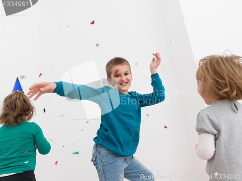 Image of kids  blowing confetti