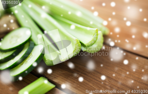 Image of close up of celery stems and sliced cucumber