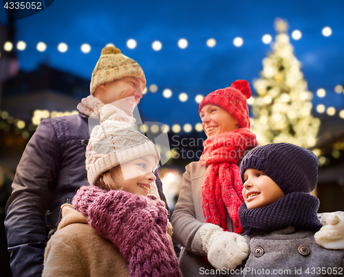 Image of happy family outdoors at christmas eve