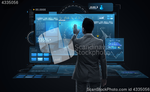 Image of businessman working with virtual reality screens