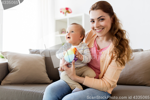 Image of happy young mother with little baby at home