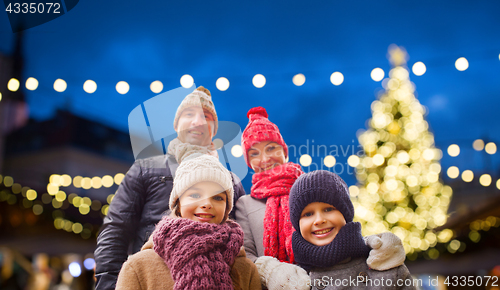 Image of happy family outdoors at christmas eve