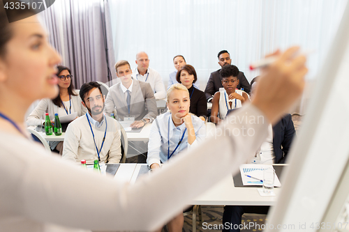 Image of group of people at business conference or lecture