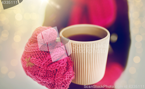 Image of close up of woman with tea mug outdoors in winter