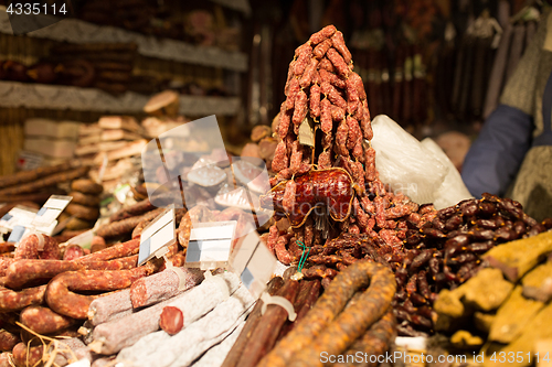 Image of smoked meat products at market or butcher shop