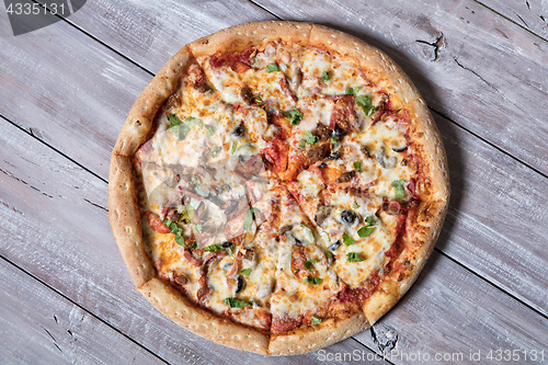 Image of Pizza On A Wooden Table