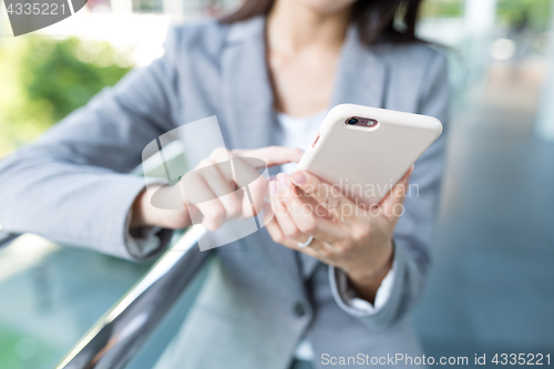 Image of Businesswoman using cellphone