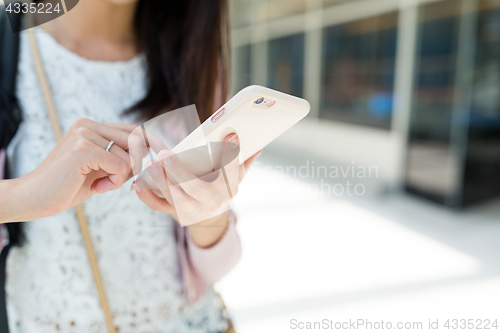 Image of Woman use of mobile phone