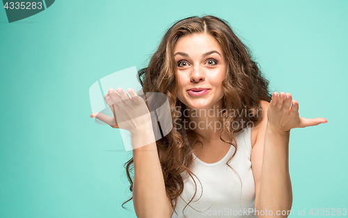 Image of Portrait of young woman with shocked facial expression