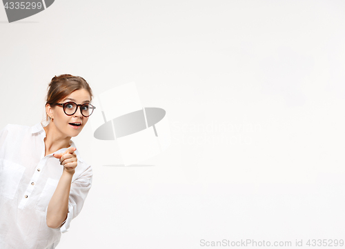 Image of Successful business woman at the office looking at camera