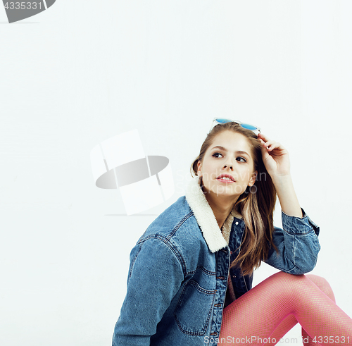 Image of young pretty teenage hipster girl posing emotional happy smiling on white background, lifestyle people concept 
