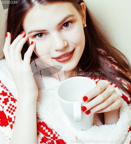 Image of young pretty brunette girl in Christmas ornament blanket getting warm on cold winter, freshness beauty concept, lifestyle people concept