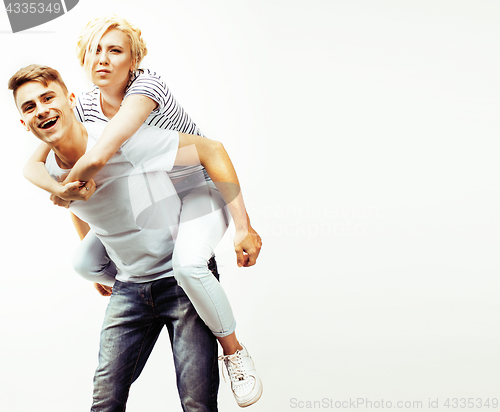 Image of young pretty teenage couple, hipster guy with his girlfriend hap