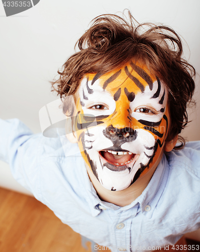 Image of little cute boy with faceart on birthday party close up, little 