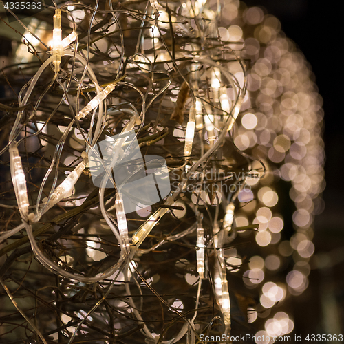 Image of Christmas street decoration with electric garland lights