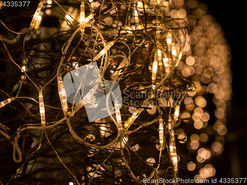 Image of Bright lights of Christmas electric garland with bokeh