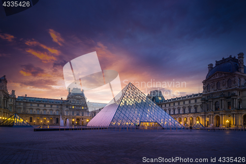 Image of View of famous Louvre Museum with Louvre Pyramid