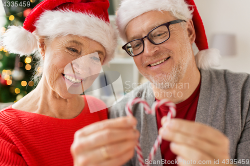 Image of close up of happy senior couple at christmas