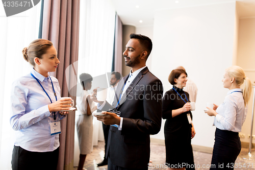 Image of happy business team at international conference