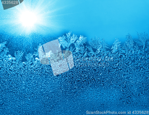 Image of Natural ice pattern and sunlight on winter glass