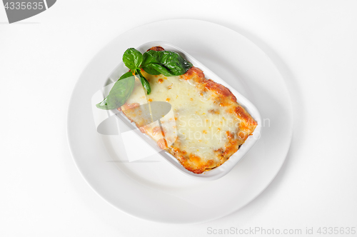 Image of Fresh hot lasagna on white