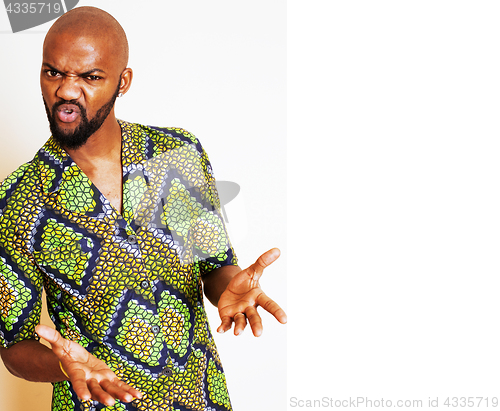 Image of portrait of young handsome african man wearing bright green nati