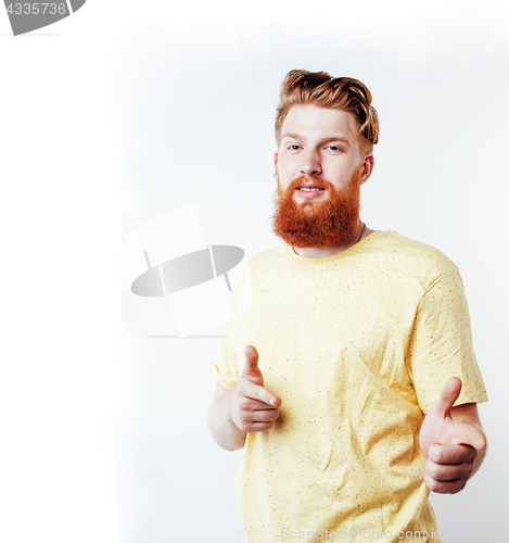 Image of young handsome hipster ginger bearded guy looking brutal isolate