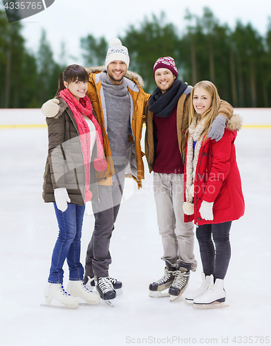 Image of friends holding hands on outdoor skating rink