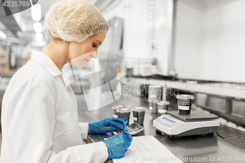 Image of woman working at ice cream factory