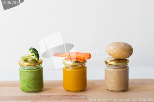 Image of vegetable puree or baby food in glass jars