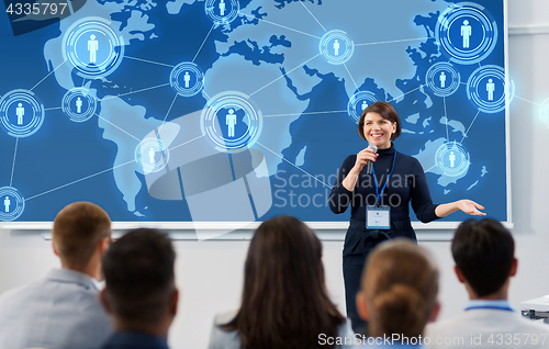 Image of group of people at business conference or lecture