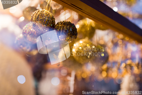 Image of close up of christmas decorations at shop window