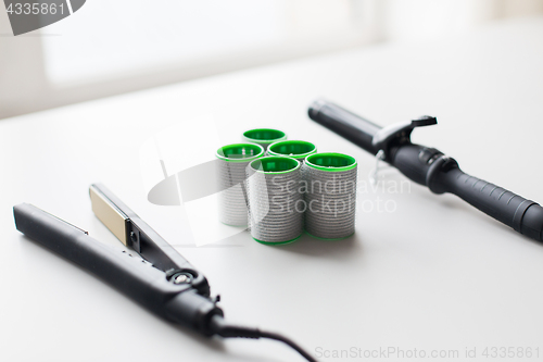 Image of curling iron, hot styler and hair curlers