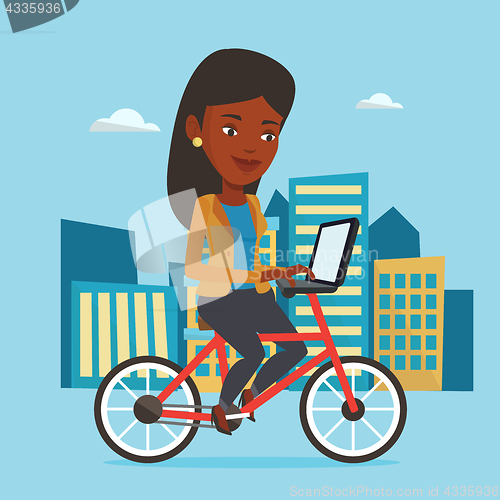 Image of Woman riding bicycle in the city.