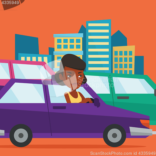 Image of Angry african woman in car stuck in traffic jam.